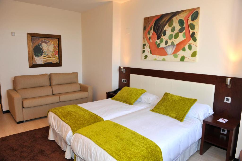 Postel nebo postele na pokoji v ubytování Hotel Don Felipe