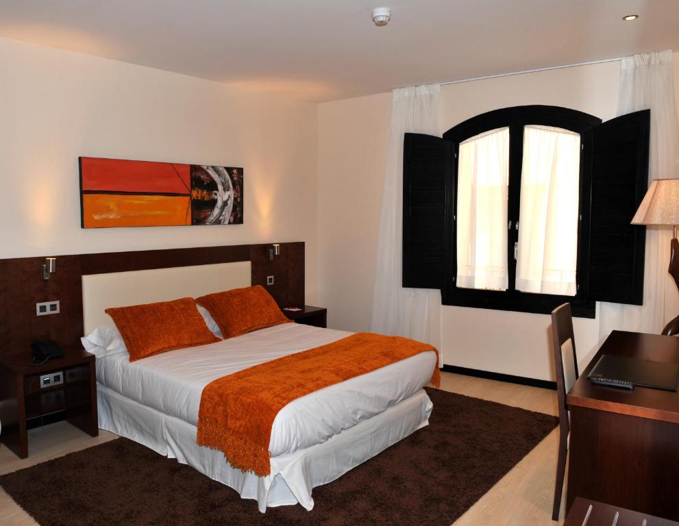 Postel nebo postele na pokoji v ubytování Hotel Don Felipe