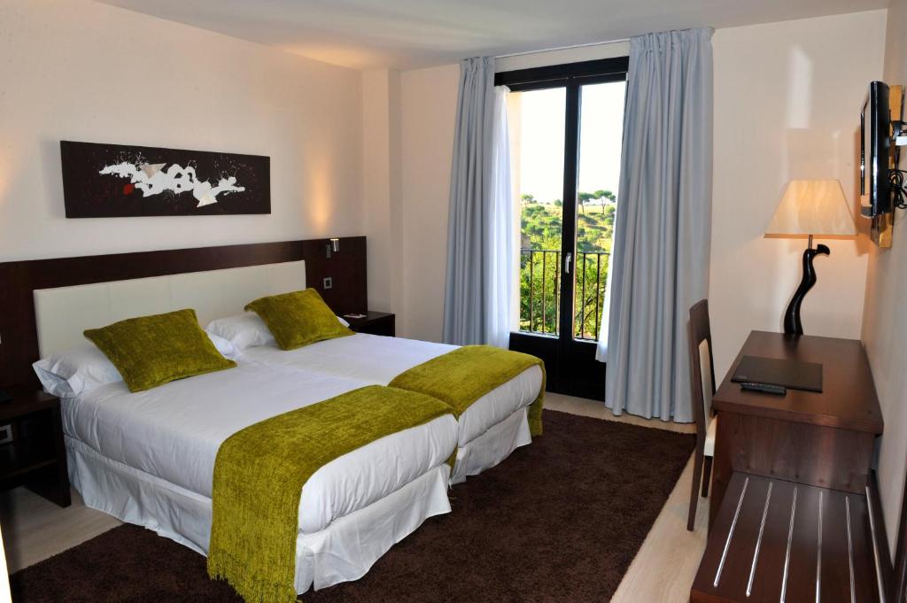 Postel nebo postele na pokoji v ubytování Hotel Don Felipe