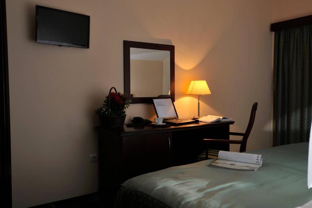 Postel nebo postele na pokoji v ubytování Zan Hotel