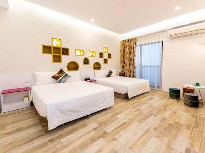 Postel nebo postele na pokoji v ubytování Haipai Sweetheart Homestay