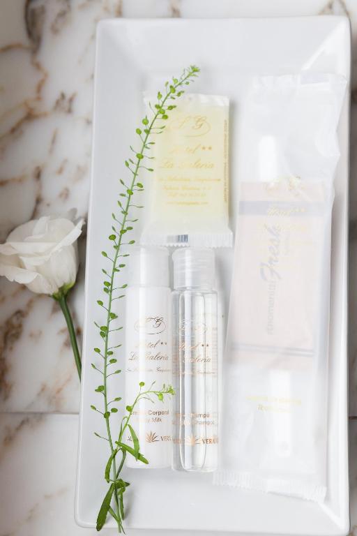 a group of products in a white box with a flower at La Galería in Donostia-San Sebastián