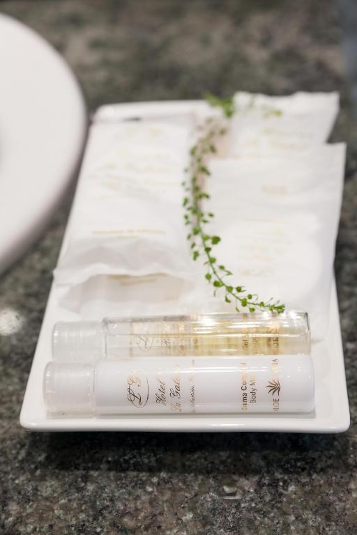 a white tray with two candles on a table at La Galería in Donostia-San Sebastián