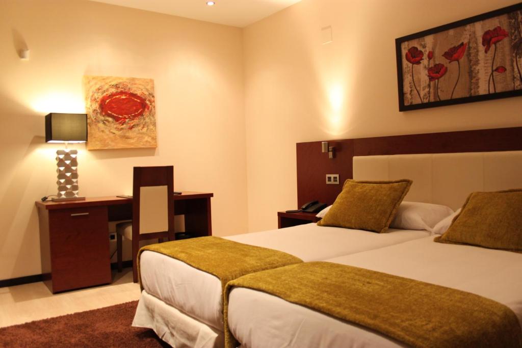 Postel nebo postele na pokoji v ubytování Hotel Don Felipe