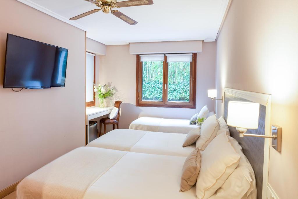 
Habitación Triple Parking Gratuito
