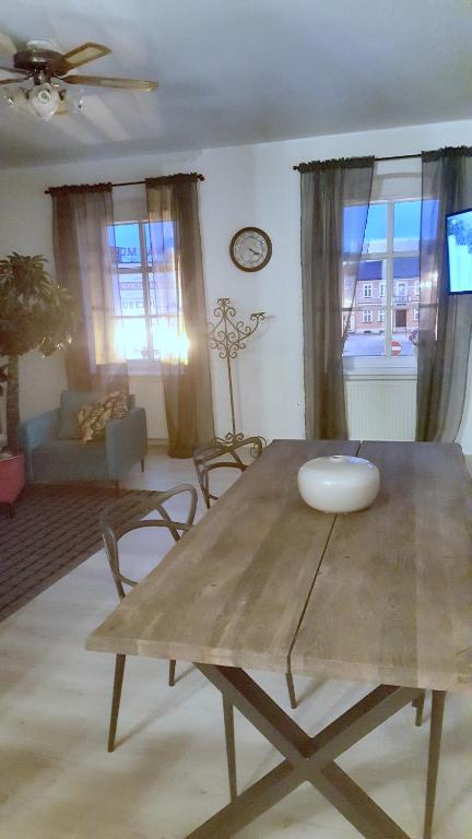 a living room with a table and a couch at Apartament Margaret Twardogóra in Twardogóra