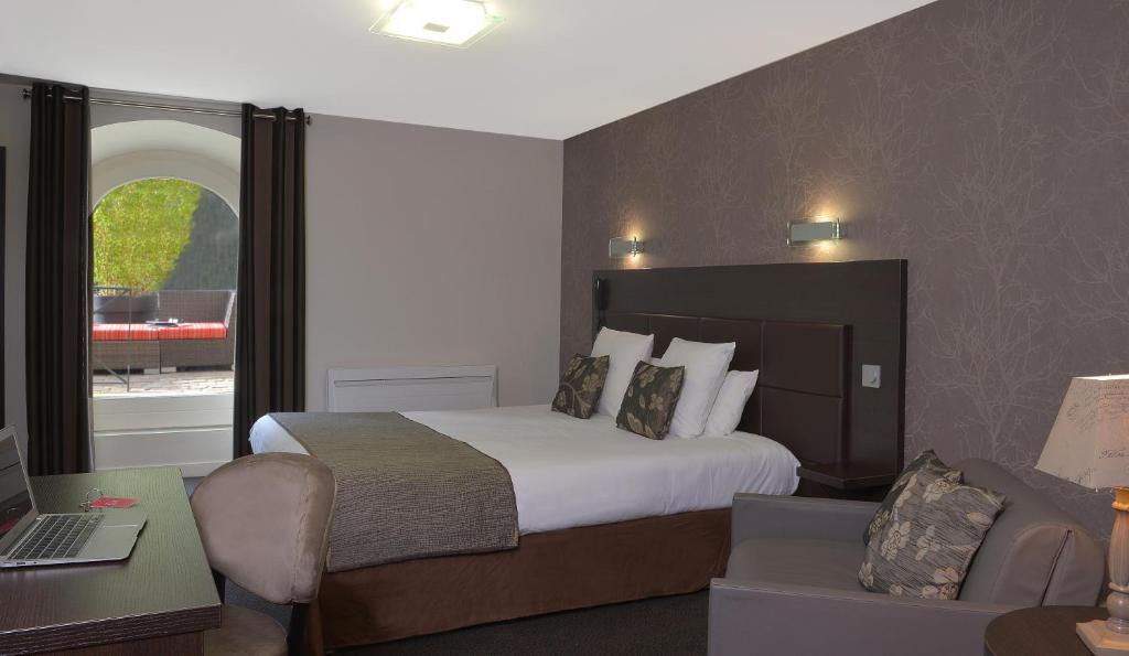Postel nebo postele na pokoji v ubytování Hotel Reine Mathilde
