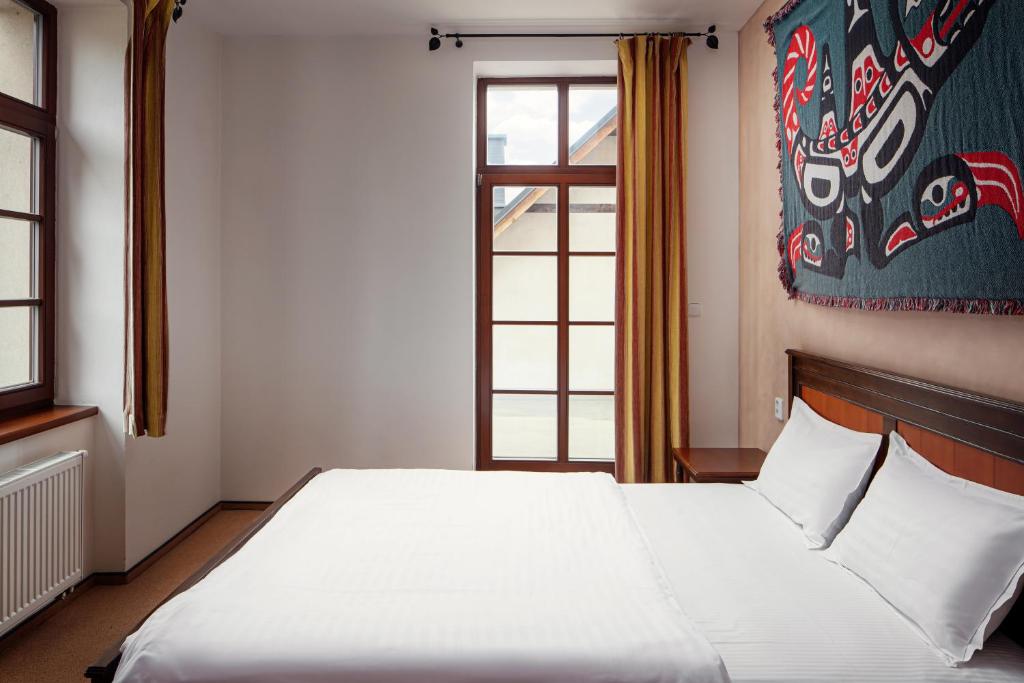 Postel nebo postele na pokoji v ubytování Hotel Javor