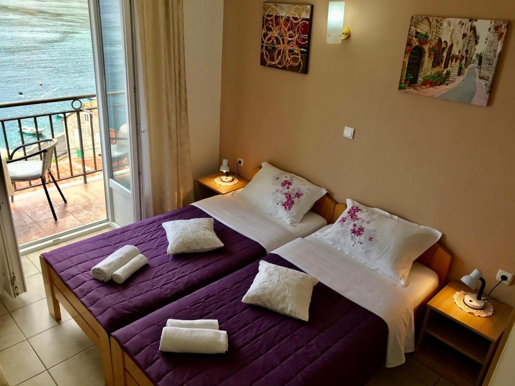 Postel nebo postele na pokoji v ubytování Apartments Okuka