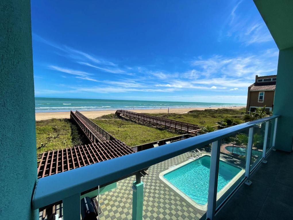 a view of the beach from the balcony of a condo at 5 BEDROOM BEACHFRONT CONDO - 2nd Floor in South Padre Island