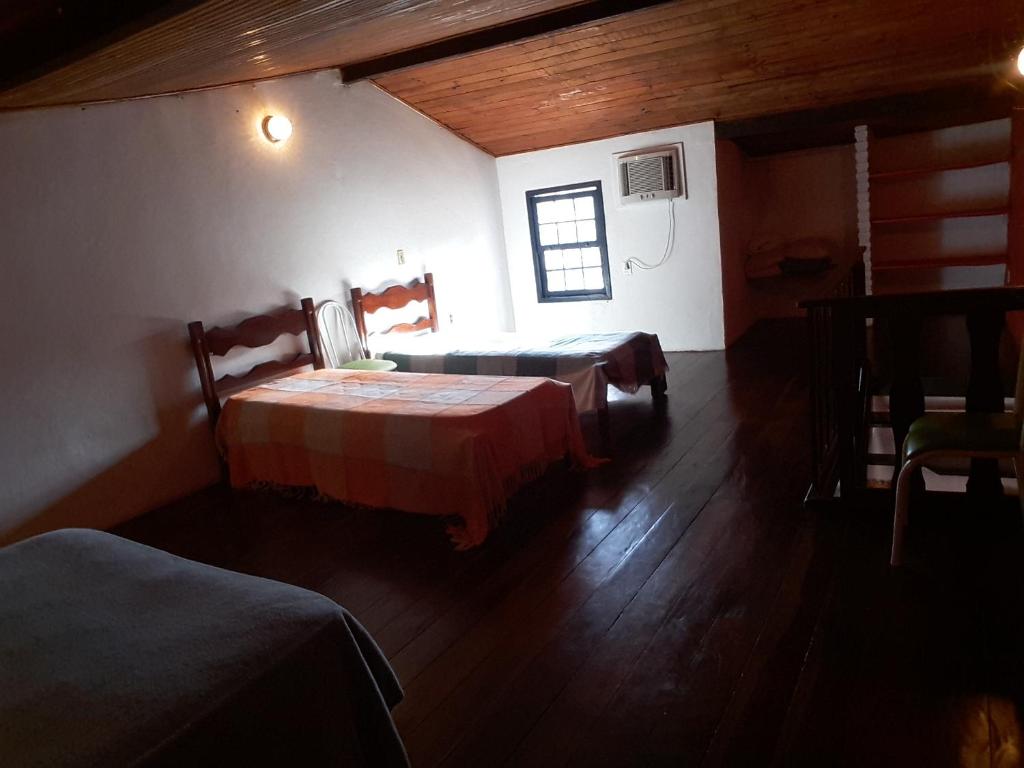 Кровать или кровати в номере Apartamento familiar centro de Buzios