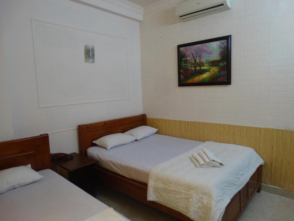 Postel nebo postele na pokoji v ubytování Thuong Hai Hotel