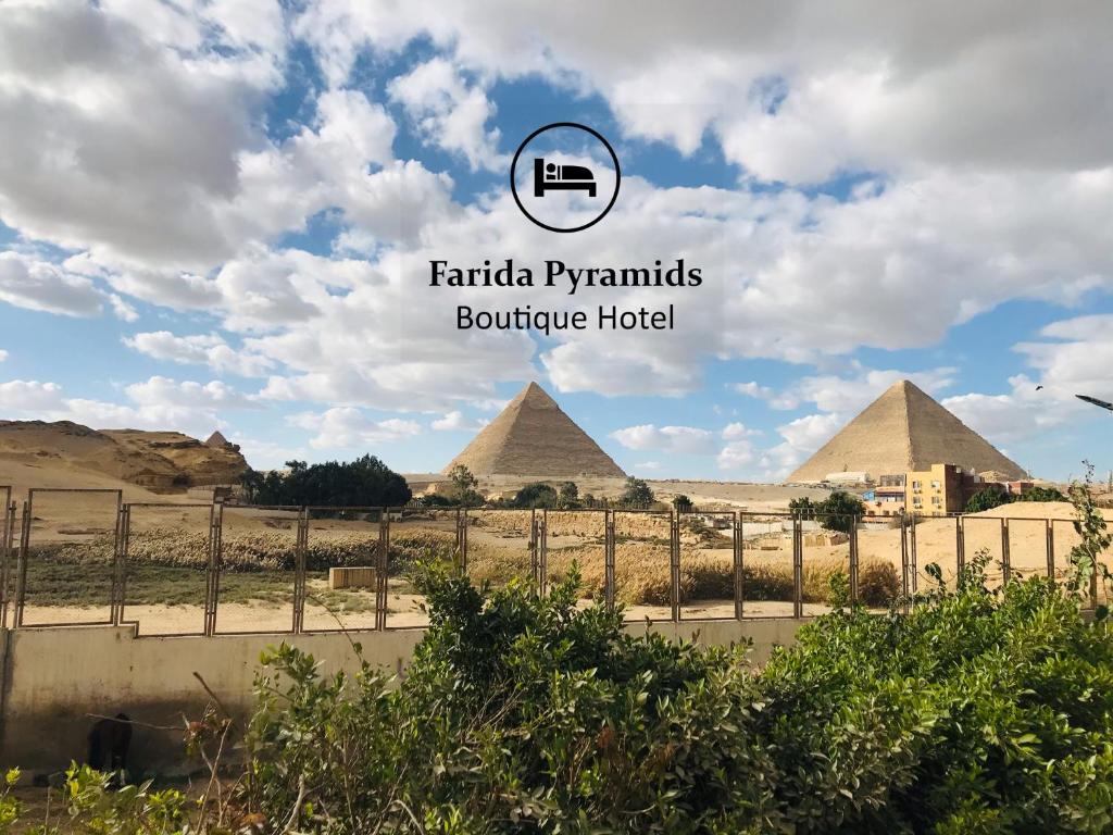 a view of the pyramids of giza and the sphinx at Farida Pyramids Boutique Hotel in Cairo
