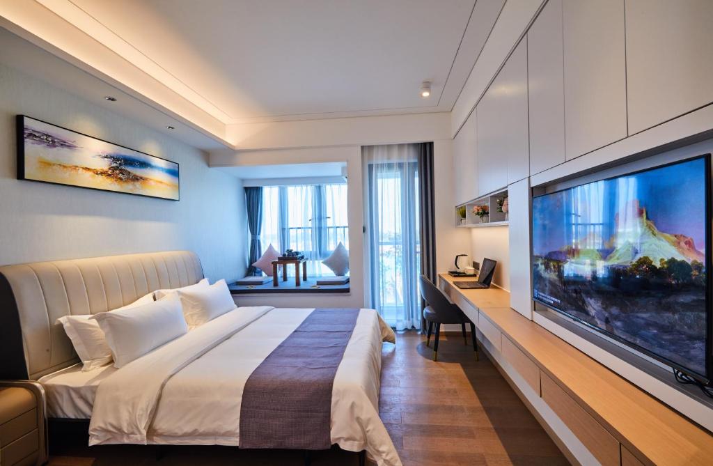 Postel nebo postele na pokoji v ubytování Kezan Condo Hotel