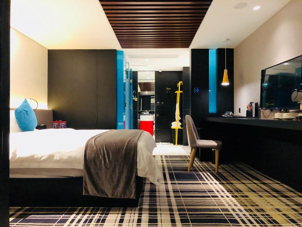 Postel nebo postele na pokoji v ubytování Likto Hotel-Free Shuttle Bus to Canton Fair