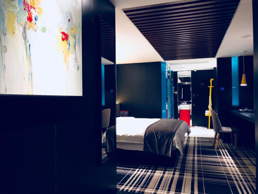 Postel nebo postele na pokoji v ubytování Likto Hotel-Free Shuttle Bus to Canton Fair