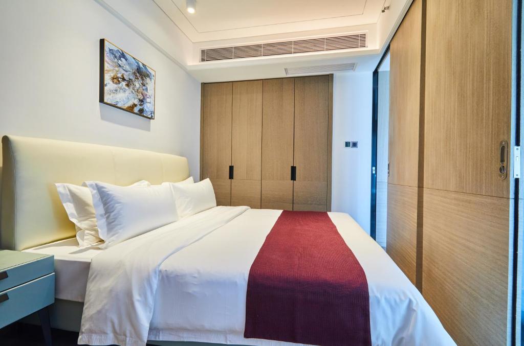 Postel nebo postele na pokoji v ubytování Kezan Condo Hotel