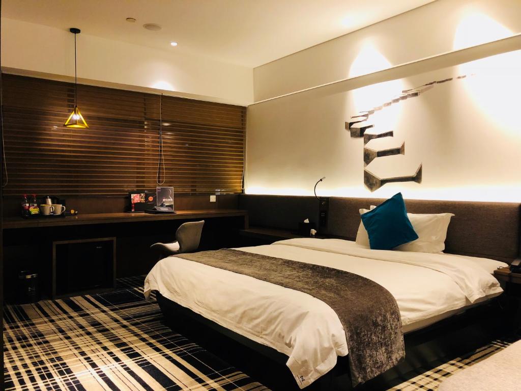 Postel nebo postele na pokoji v ubytování Likto Hotel-Free Shuttle Bus to Canton Fair