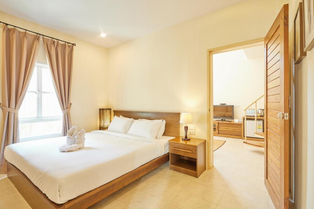 Postel nebo postele na pokoji v ubytování Talay Hotel and Villa Cha-am