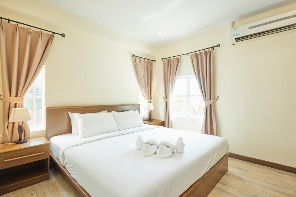 Postel nebo postele na pokoji v ubytování Talay Hotel and Villa Cha-am