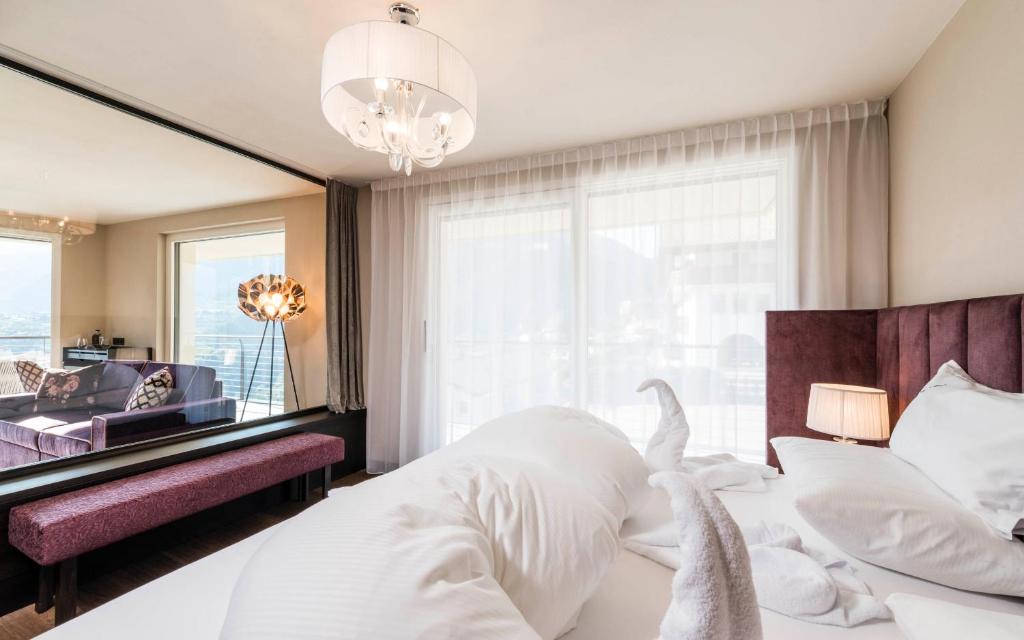 Posteľ alebo postele v izbe v ubytovaní Prunner Luxury Suites - Adults Only