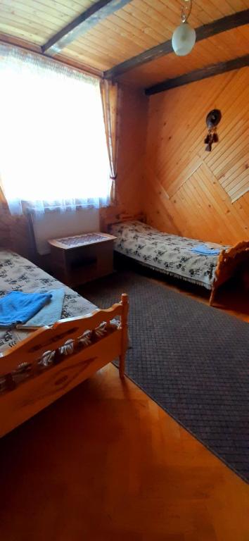Postel nebo postele na pokoji v ubytování Rosinka