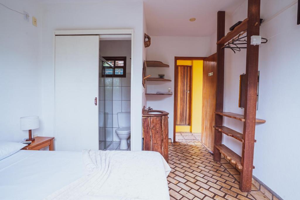 Cama ou camas em um quarto em Pousada Alto do Cajueiro