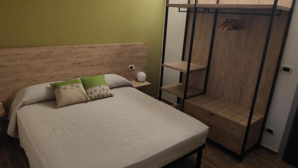 Postel nebo postele na pokoji v ubytování B&B Tra Gli Ulivi