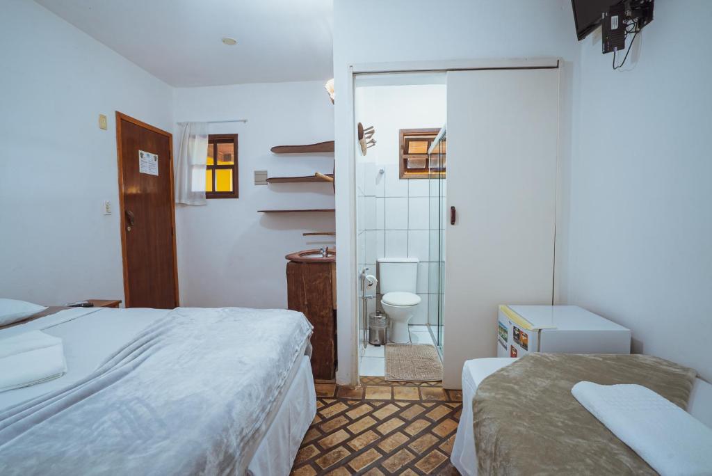 Cama ou camas em um quarto em Pousada Alto do Cajueiro