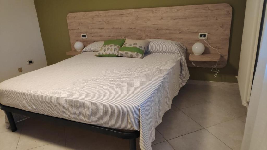 Postel nebo postele na pokoji v ubytování B&B Tra Gli Ulivi