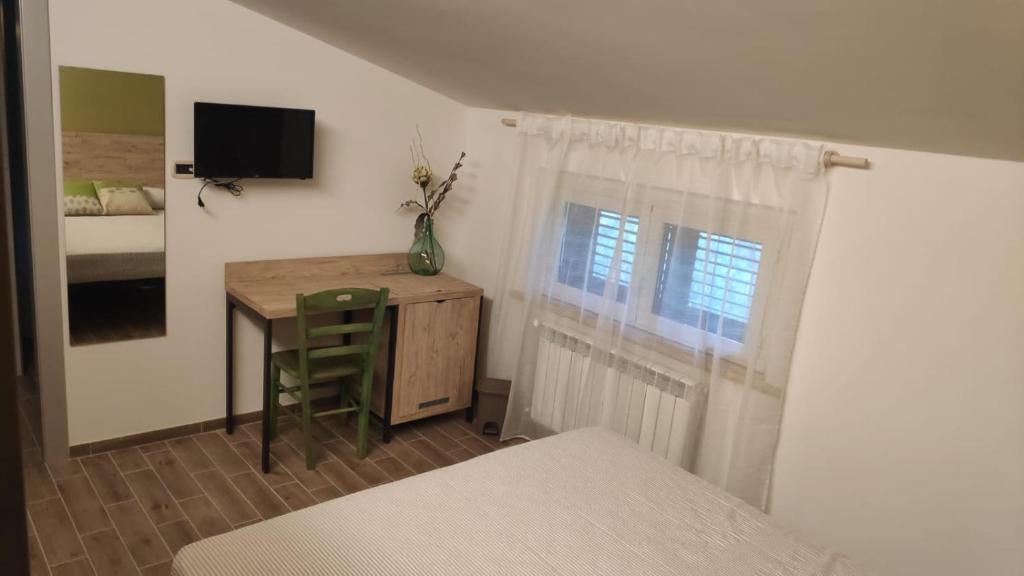 Postel nebo postele na pokoji v ubytování B&B Tra Gli Ulivi