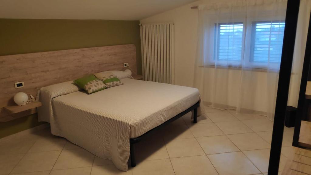 Postel nebo postele na pokoji v ubytování B&B Tra Gli Ulivi