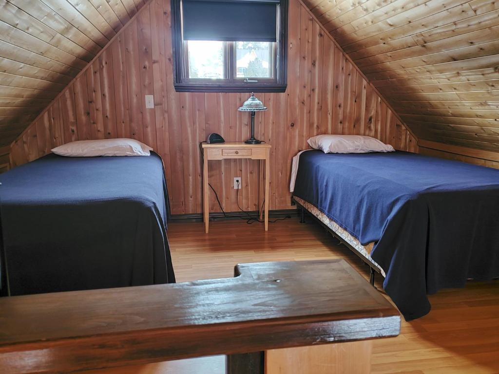 Postel nebo postele na pokoji v ubytování Chalets de l'Anse Ste Helene
