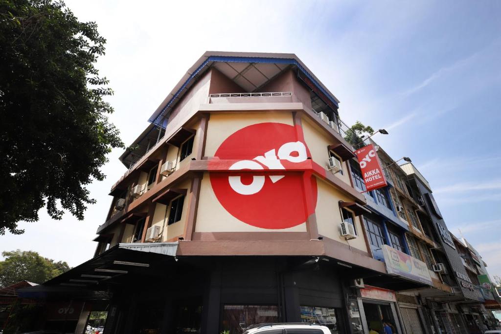 a building with a face painted on the side of it at OYO 507 Aikka Hotel in Butterworth