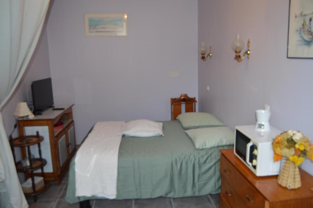 Ένα ή περισσότερα κρεβάτια σε δωμάτιο στο Chambre Charentaise