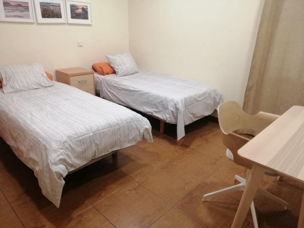 Postel nebo postele na pokoji v ubytování Apartamento Hierro 21-2
