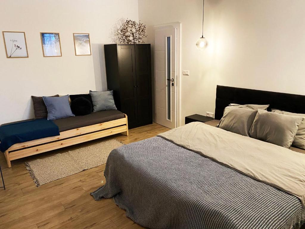 Postel nebo postele na pokoji v ubytování Apartmány Elli