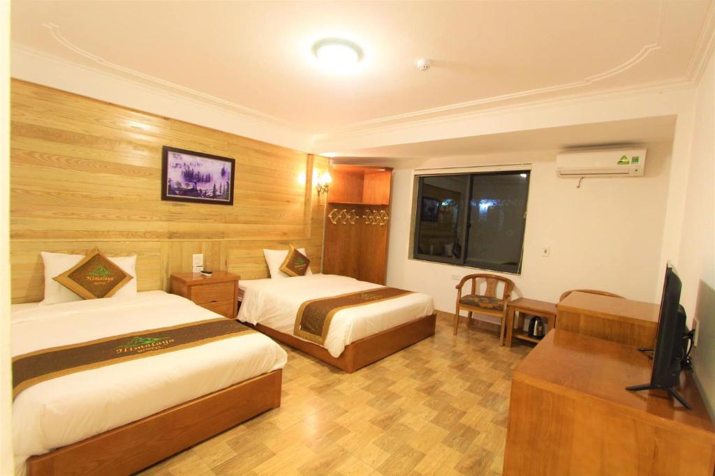 Postel nebo postele na pokoji v ubytování Himalaya Sapa Hostel