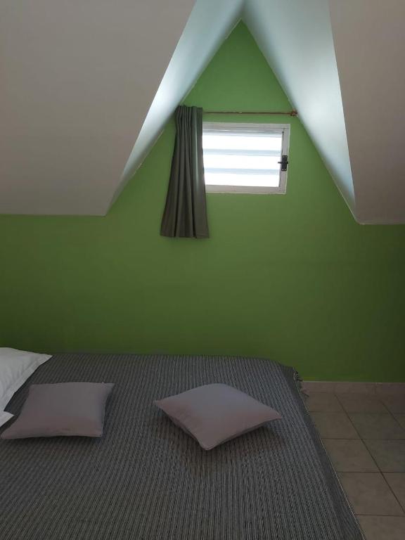 Postel nebo postele na pokoji v ubytování Gîte Muskad