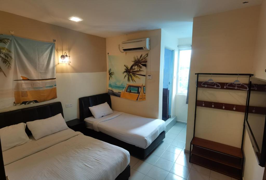 Postel nebo postele na pokoji v ubytování NGS Hotel