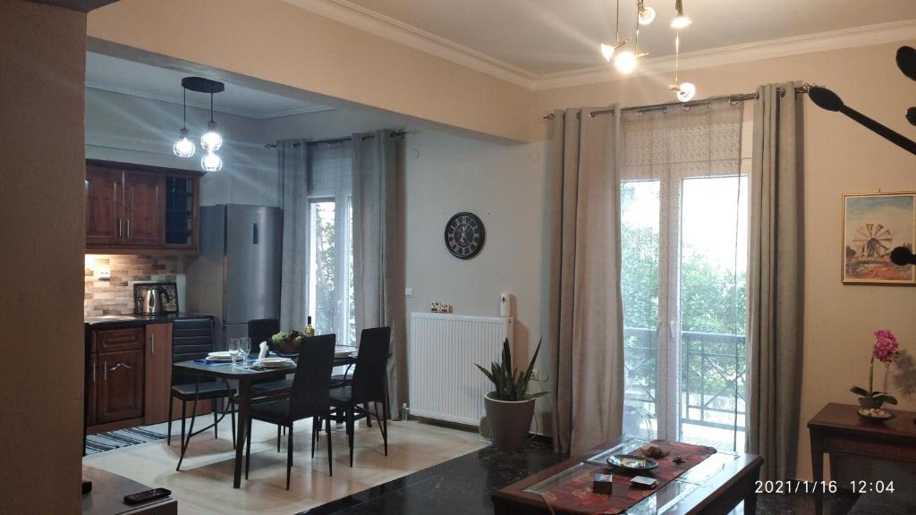 a kitchen and dining room with a table and chairs at Miriam Luxury apartment in Zakynthos Town