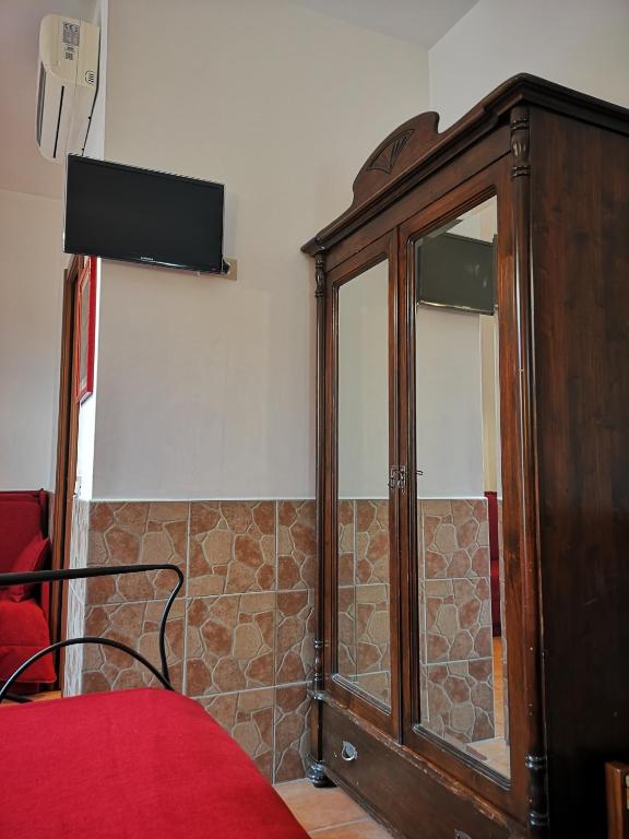 TV a/nebo společenská místnost v ubytování Vecchia Roma Resort
