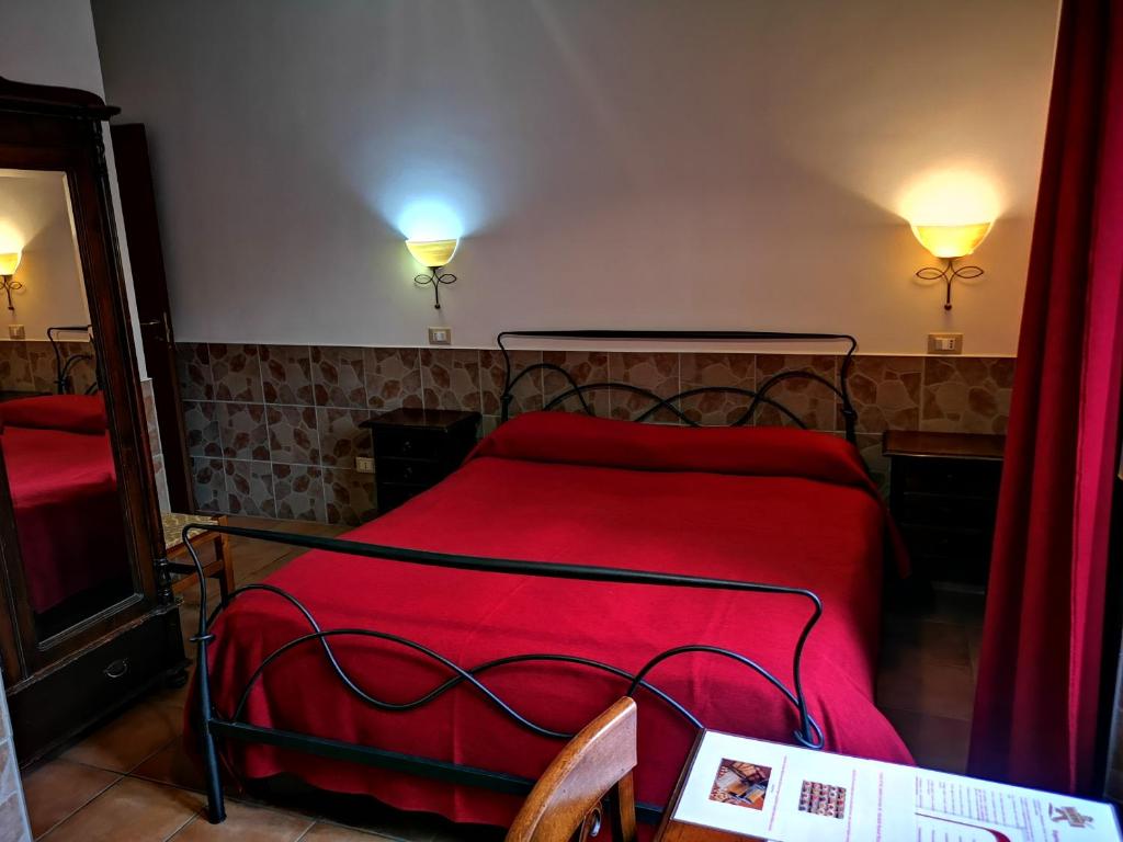 Postel nebo postele na pokoji v ubytování Vecchia Roma Resort