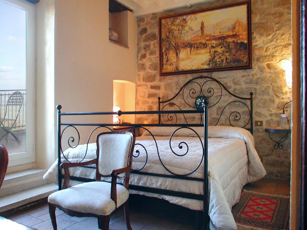 Postel nebo postele na pokoji v ubytování Albergo Il Giglio