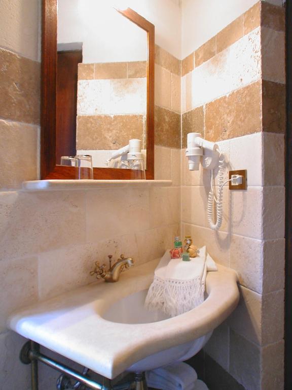 Koupelna v ubytování Albergo Il Giglio