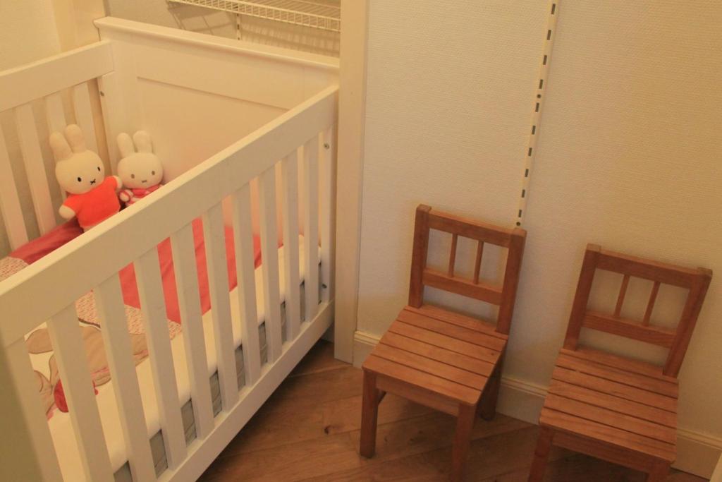 Postel nebo postele na pokoji v ubytování Gastenverblijf Huize Pervijze
