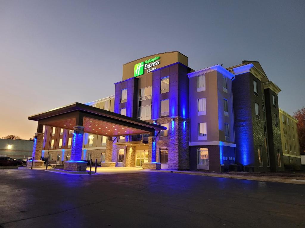 a hotel with blue lights in front of a building at Holiday Inn Express Hotel & Suites Starkville, an IHG Hotel in Starkville