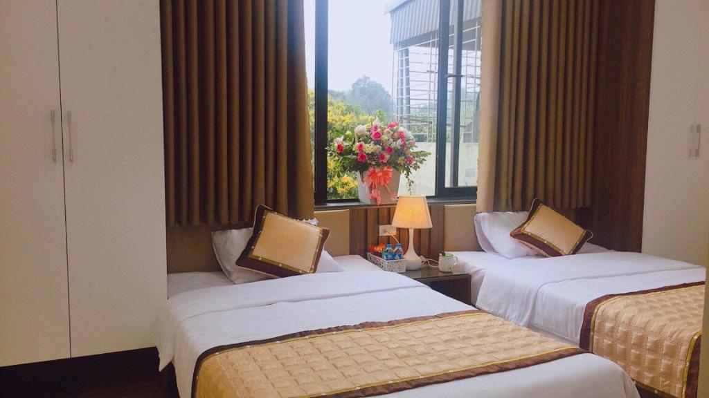 מיטה או מיטות בחדר ב-Khách sạn Phương Nam