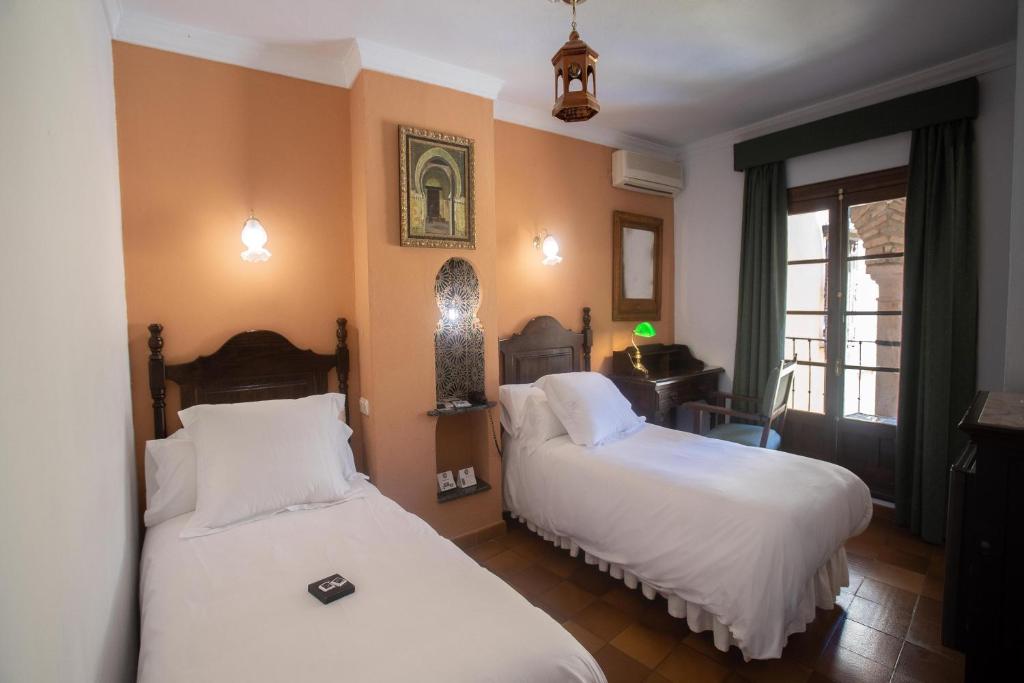 Posteľ alebo postele v izbe v ubytovaní Hotel Soho Boutique Palacio San Gabriel