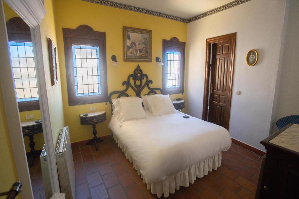 Posteľ alebo postele v izbe v ubytovaní Hotel Soho Boutique Palacio San Gabriel